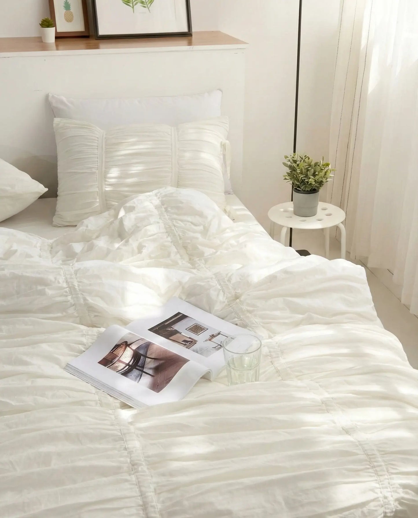 White ruched pillow sham on bed, aesthetic bedding, luxury pillow cover, dorm room decor, gathered fabric detail, neutral bedroom style, textured pillow, cozy sleep, modern home decor, elegant bedding