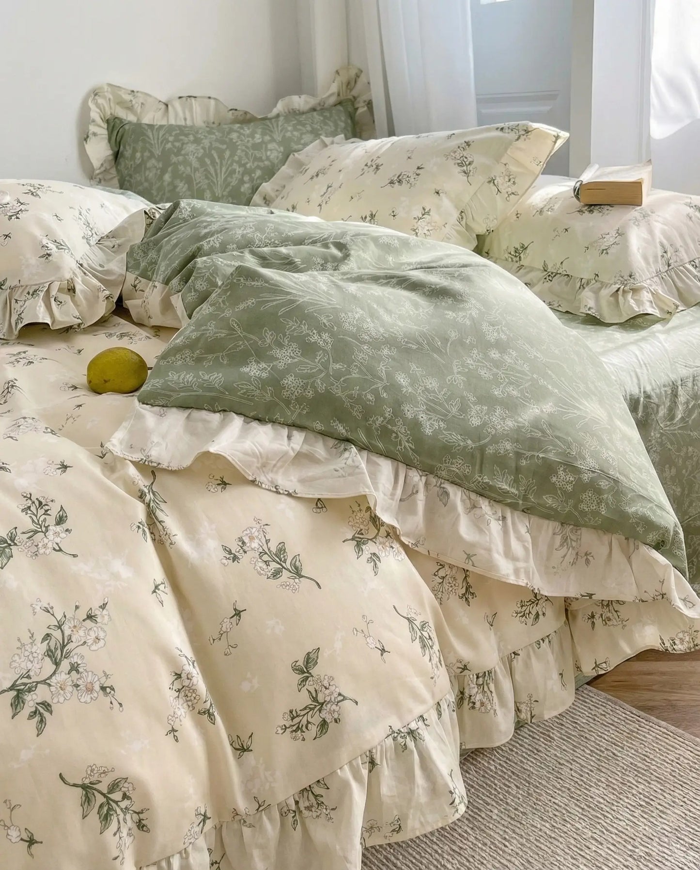 Vintage inspired floral bedding set with sage green sheets and romantic ruffle trim in cozy bedroom