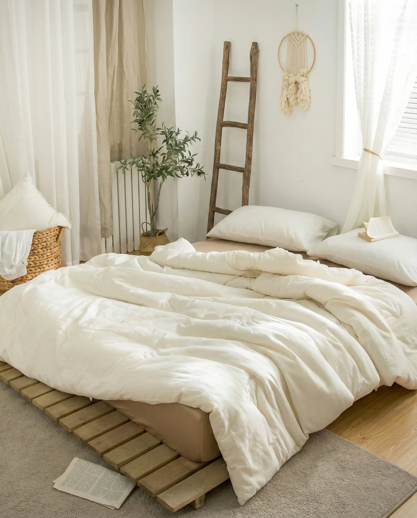 Breathable organic soybean fiber duvet insert draped on a minimalist bed with neutral decor, hypoallergenic cotton shell duvet insert by DORMÉ Studio.