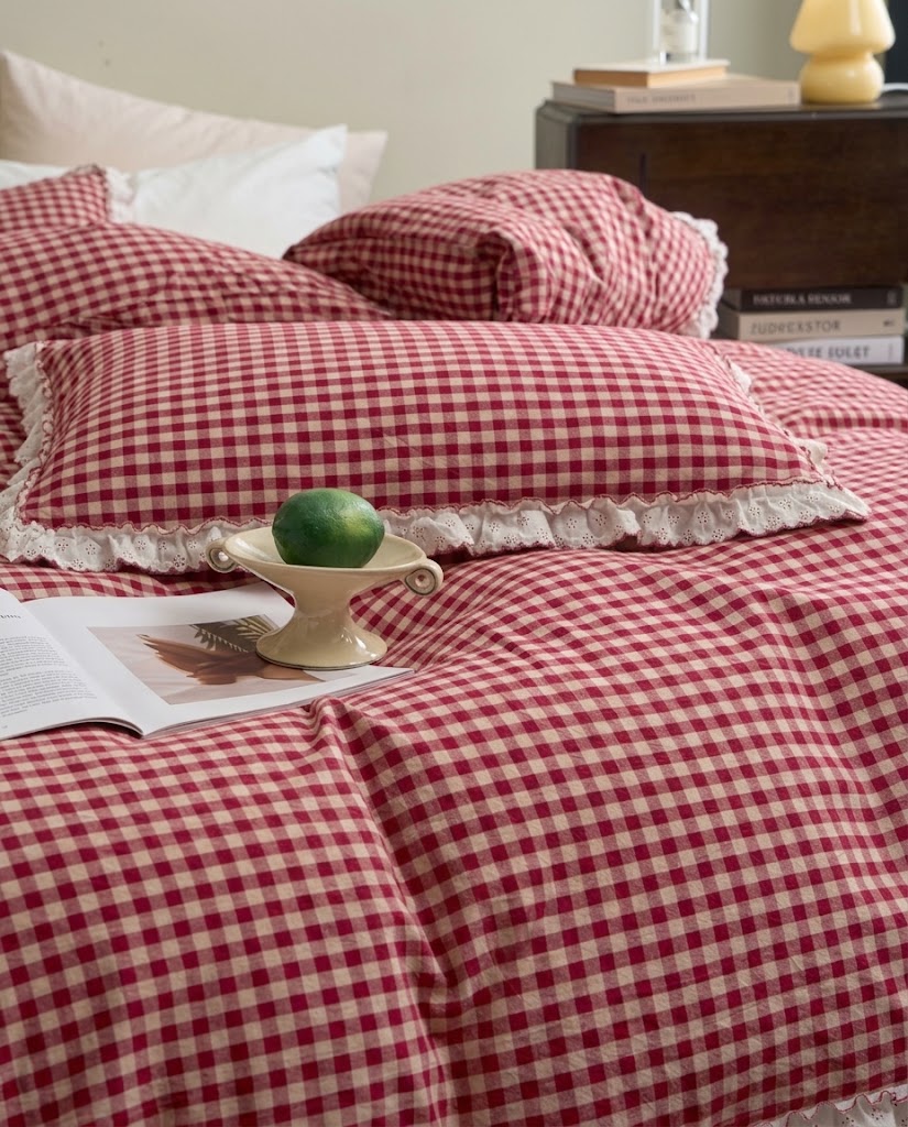Washed cotton gingham duvet cover and eyelet ruffle pillowcase with a lime on a ceramic dish