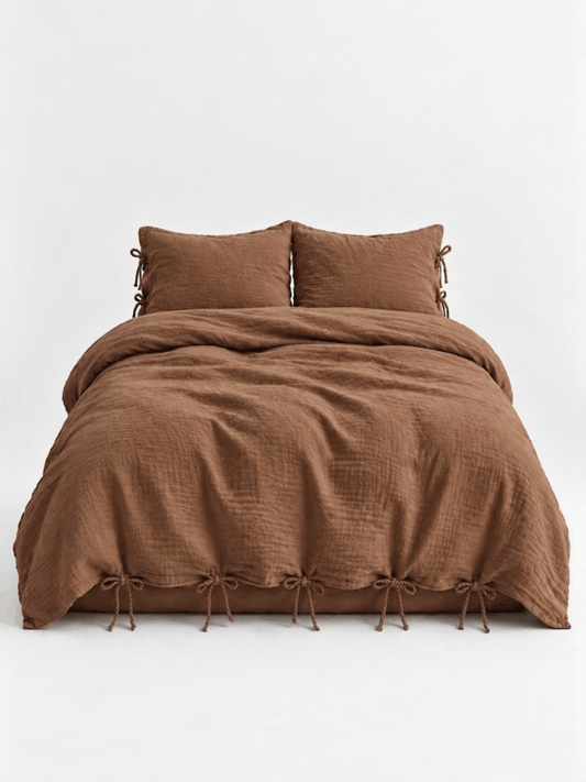 Cinnamon muslin cotton duvet cover set by DORMÉ Studio with bow tie closures, front view on white background