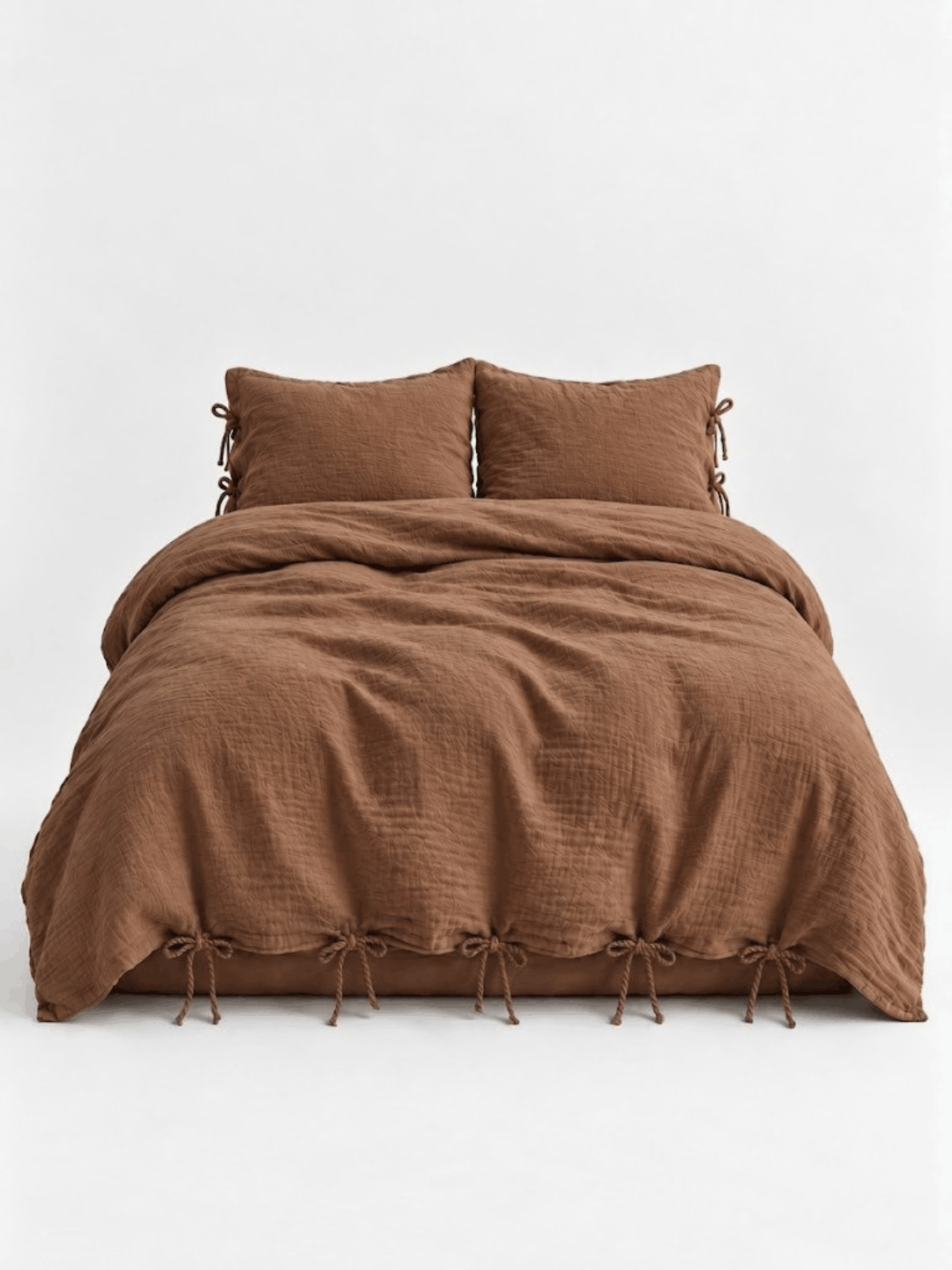 Cinnamon muslin cotton duvet cover set by DORMÉ Studio with bow tie closures, front view on white background