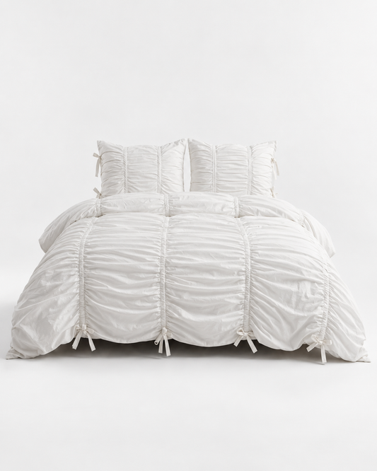 Classic White Ruched Duvet Cover Set on white background showing full gathered fabric texture, ruched pillow shams, and signature bow tie details