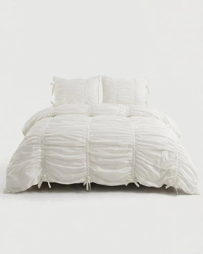 Classic White Ruched Duvet Cover Set on white background showing full gathered fabric texture, ruched pillow shams, and signature bow tie details