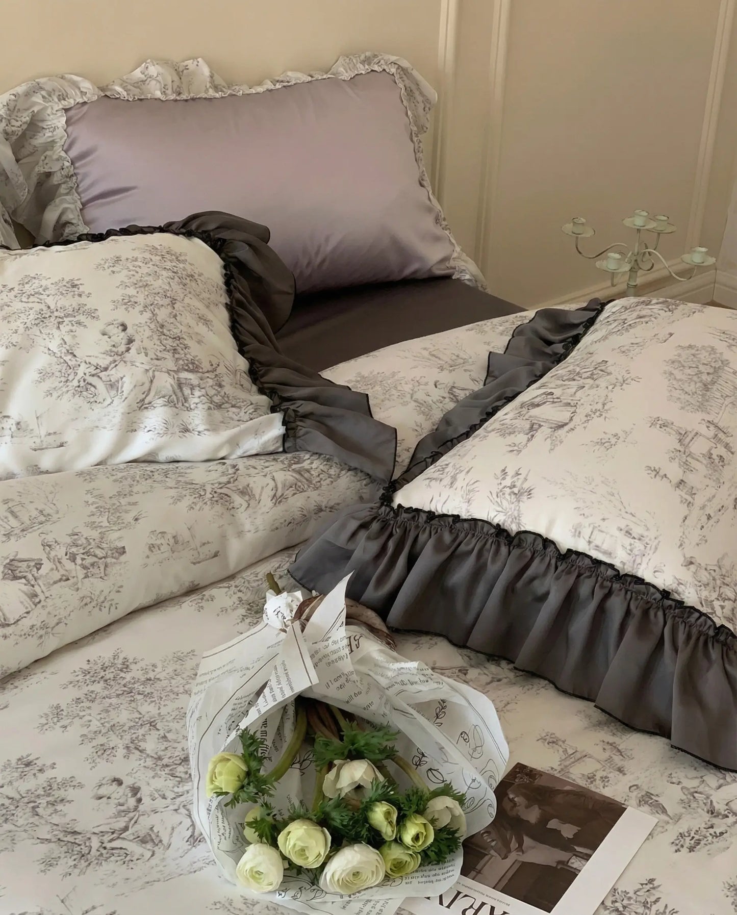 Toile duvet cover styled on bed with dark gray sheets and ruffled pillowcases, elegant aesthetic bedroom setup