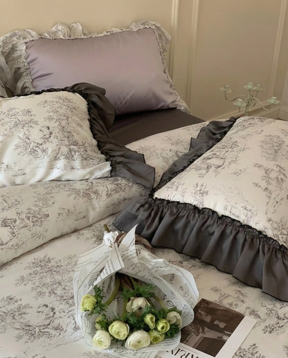 Toile duvet cover styled on bed with dark gray sheets and ruffled pillowcases, elegant aesthetic bedroom setup