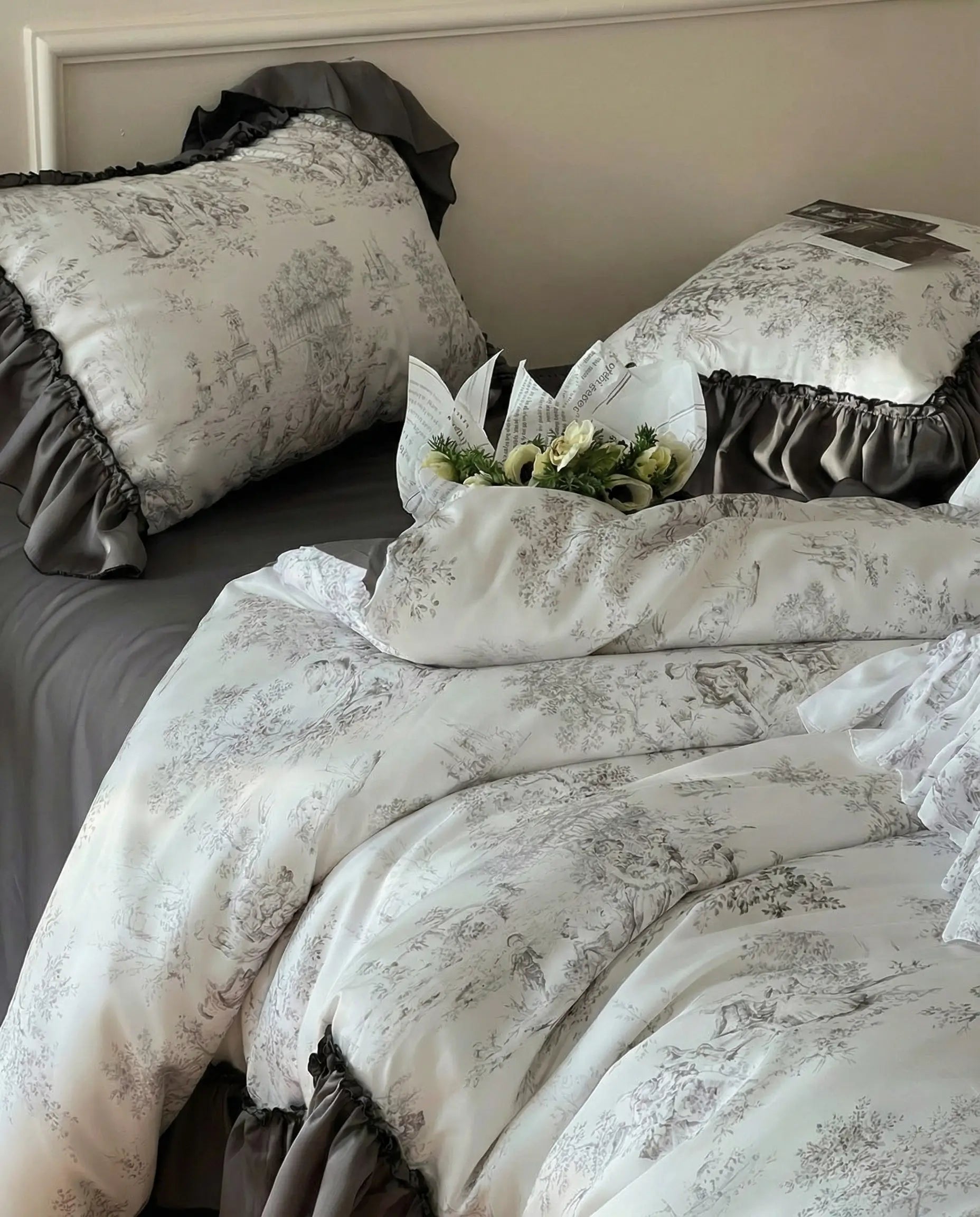Toile duvet cover draped across bed with ruffled hem and vintage print, soft romantic bedroom aesthetic