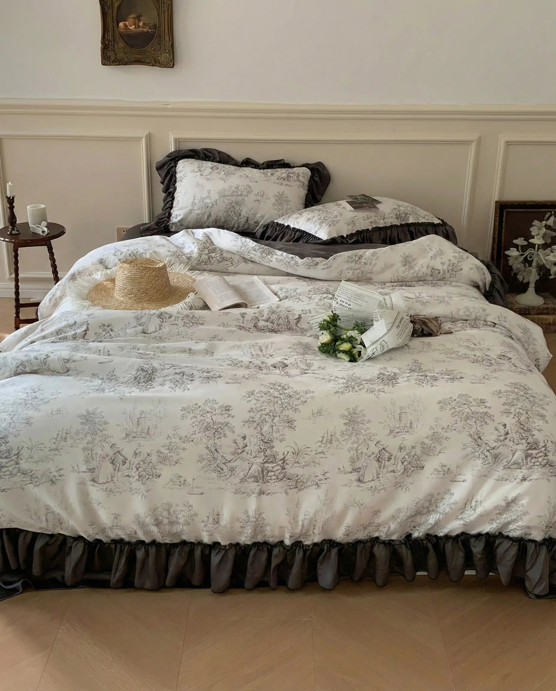 Full bed view of ivory toile duvet cover with charcoal ruffle skirt, elegant vintage bedroom decor