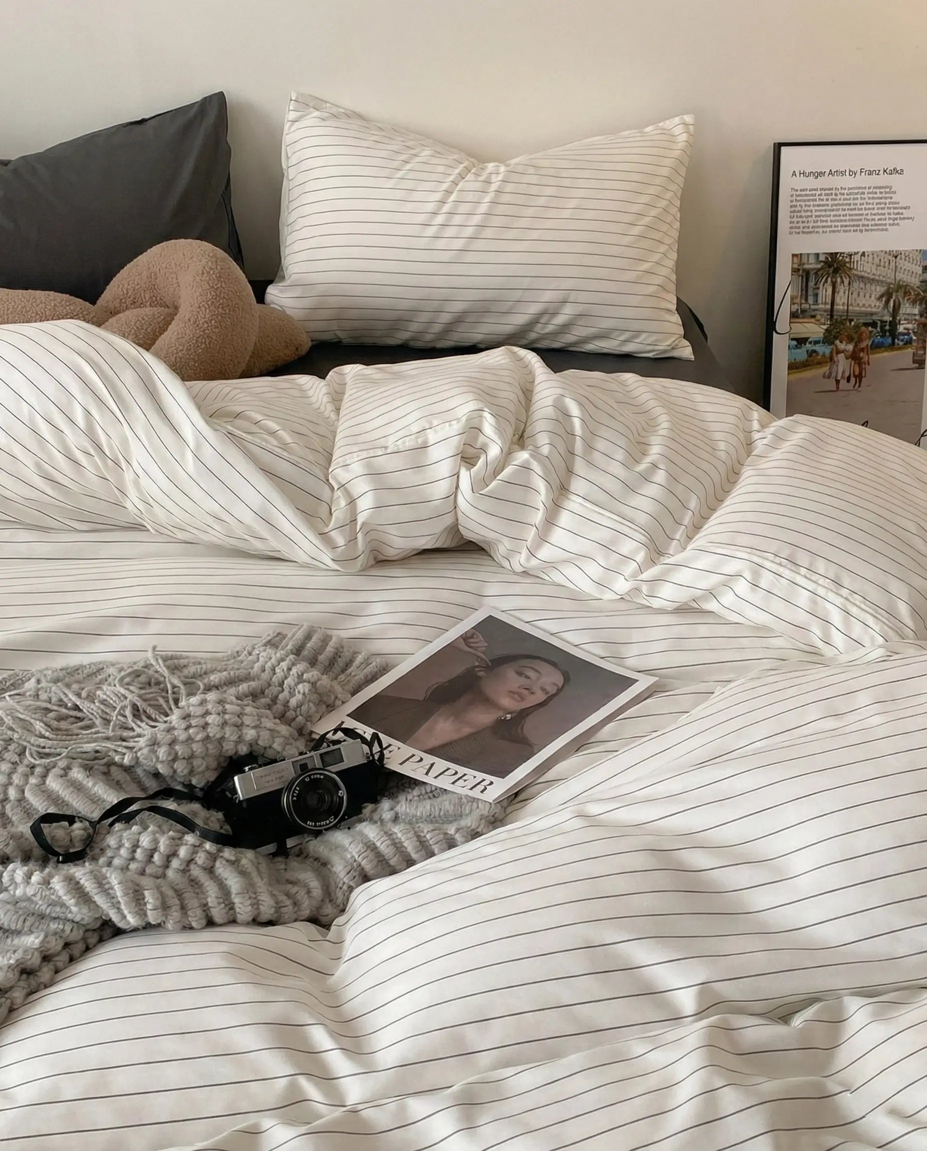 Pinstripe duvet cover styled in a cozy bedroom with neutral decor, soft lighting, and relaxed folds for an effortless lived-in aesthetic.