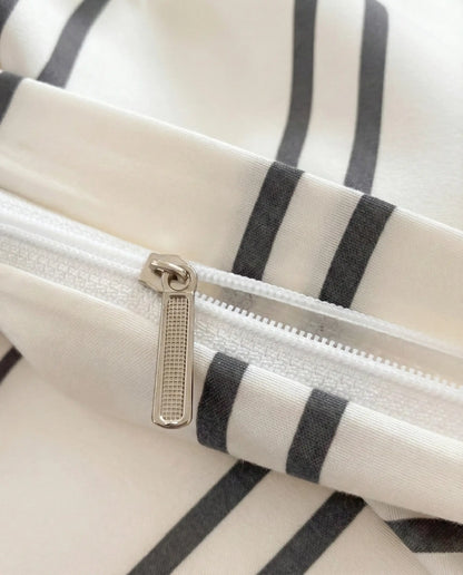 Soft striped duvet cover with hidden zipper closure, designed for a smooth finish, secure fit, and easy insert removal for effortless bed styling.
