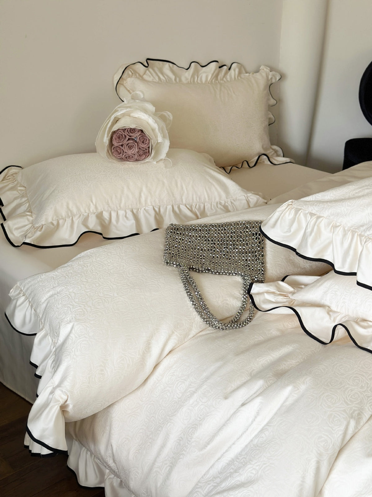 Camellia Ruffled Duvet Cover Set in Ivory with rose jacquard duvet cover and ruffled black piped shams
