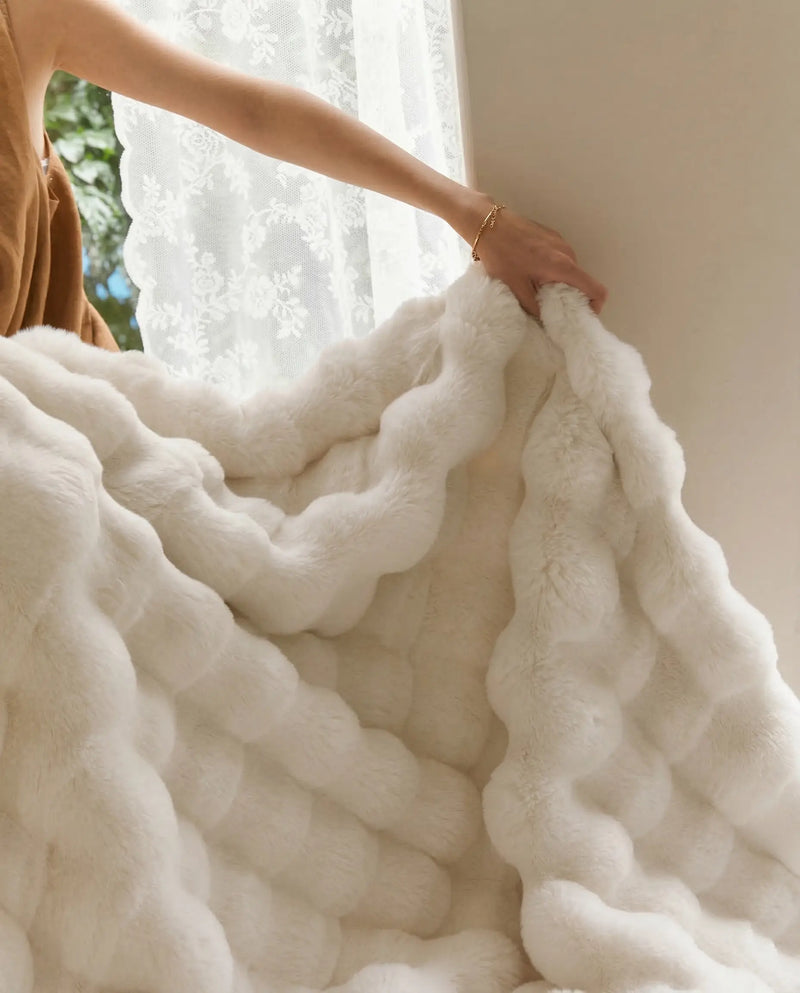 Close up of DORMÉ Studio Marshmallow Ultra Plush Blanket showing thick sculpted plush texture and soft premium fabric. White