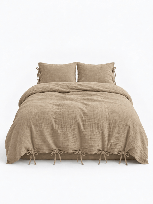 Natural Oat muslin cotton duvet cover set by DORMÉ Studio with bow tie closures, front view on white background