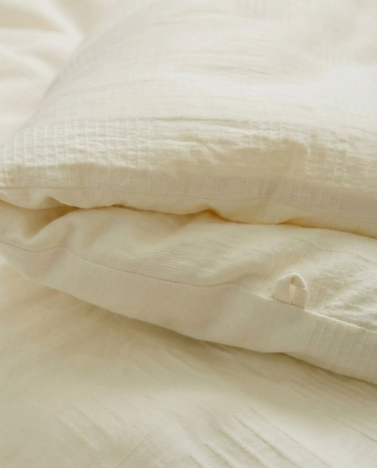 Close up of organic soybean fiber duvet insert fabric showing breathable cotton shell texture and premium stitching by DORMÉ Studio.