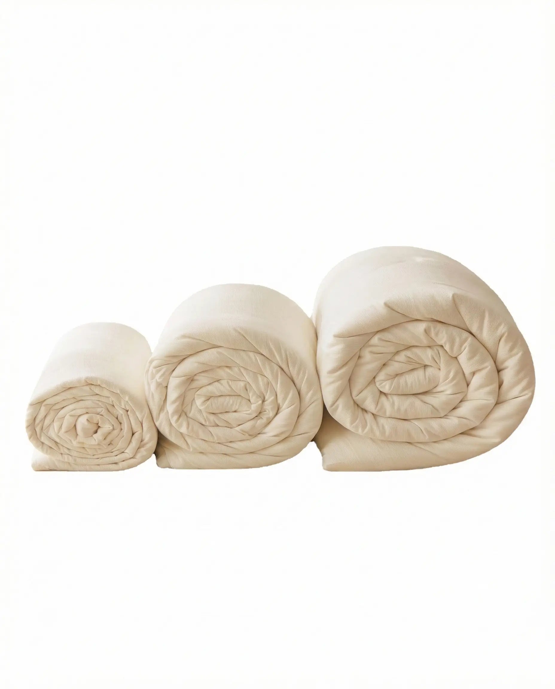 Rolled organic soybean fiber duvet inserts in multiple sizes including twin queen and king, breathable hypoallergenic duvet insert by DORMÉ Studio.