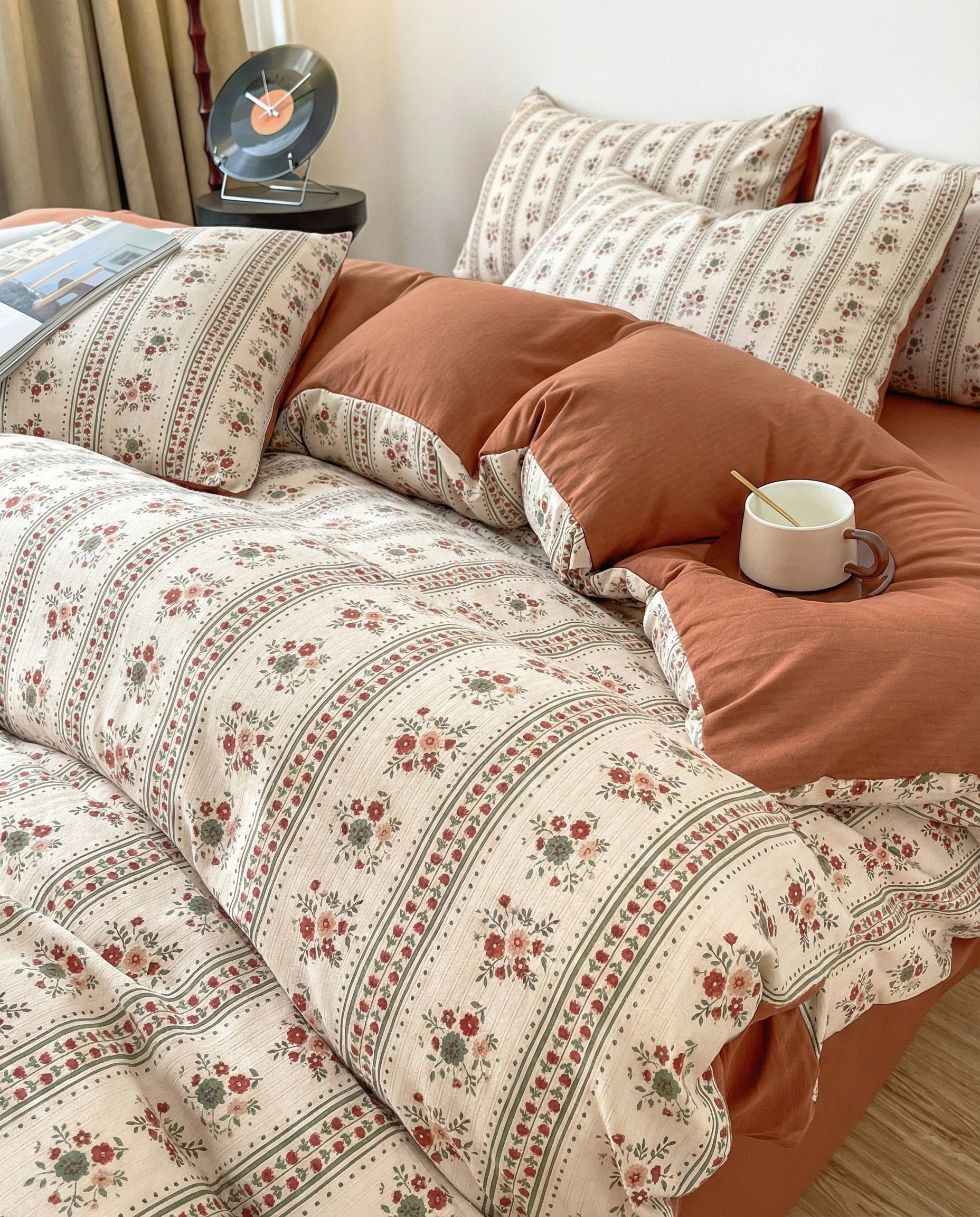 Retro floral duvet cover set in terracotta tones with soft draping fabric, cozy bedroom styling and natural light