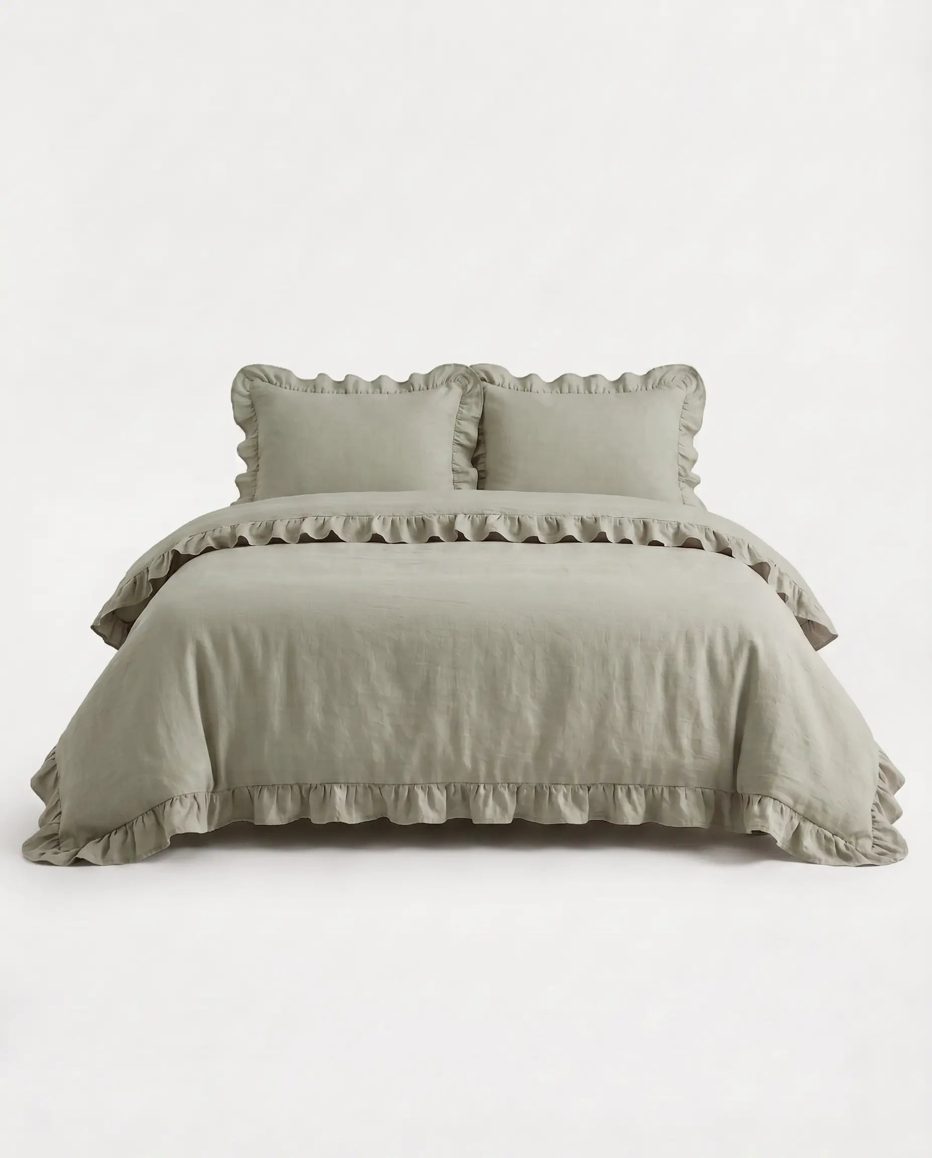 Front-facing studio image of the Rosalie eucalyptus sage ruffle duvet cover set with matching pillowcases and elegant trim