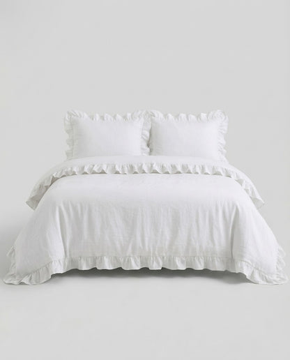 Front-facing studio image of the Rosalie snow white ruffle duvet cover set with matching pillowcases and romantic trim details