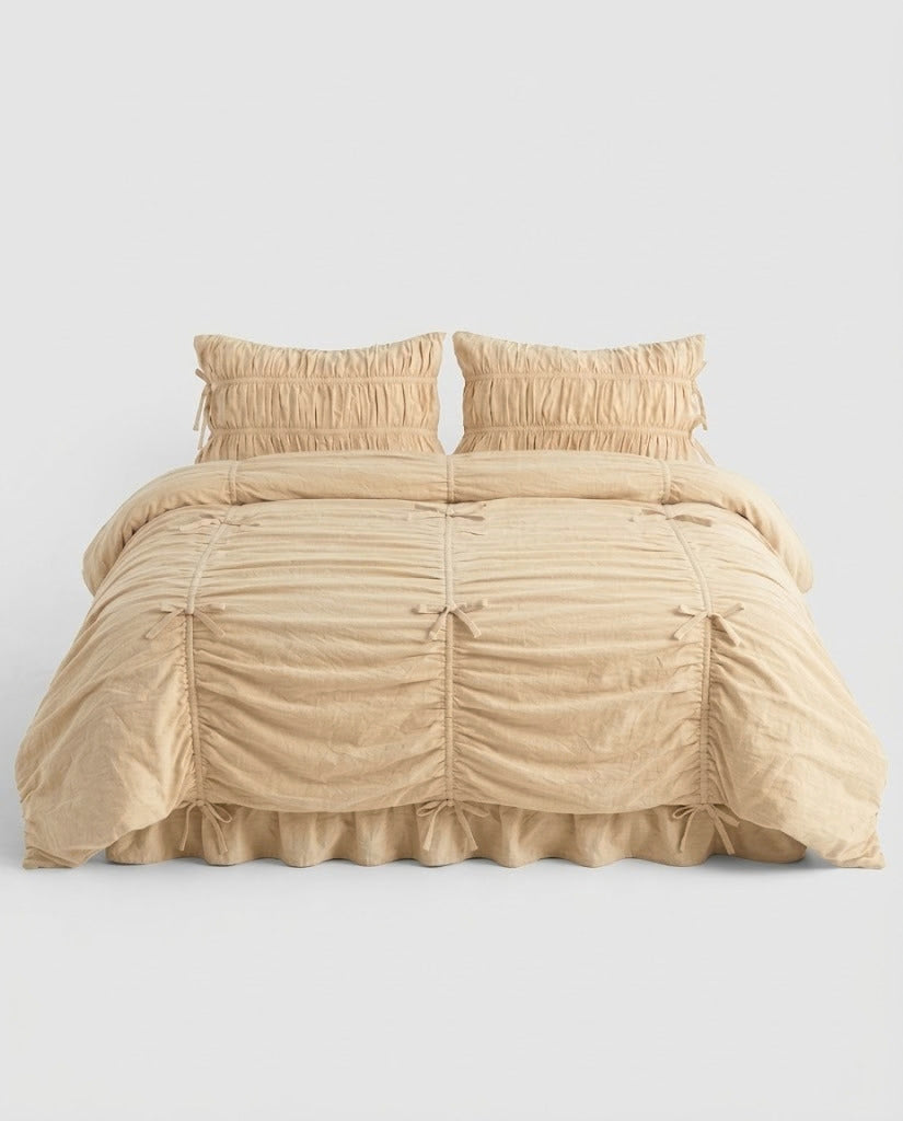 Royal Ruched Duvet Cover Set in cream washed cotton with bow-tied ruched channels, two ruched pillowcases and a ruffled bed skirt