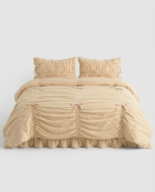 Royal Ruched Duvet Cover Set in cream washed cotton with bow-tied ruched channels, two ruched pillowcases and a ruffled bed skirt