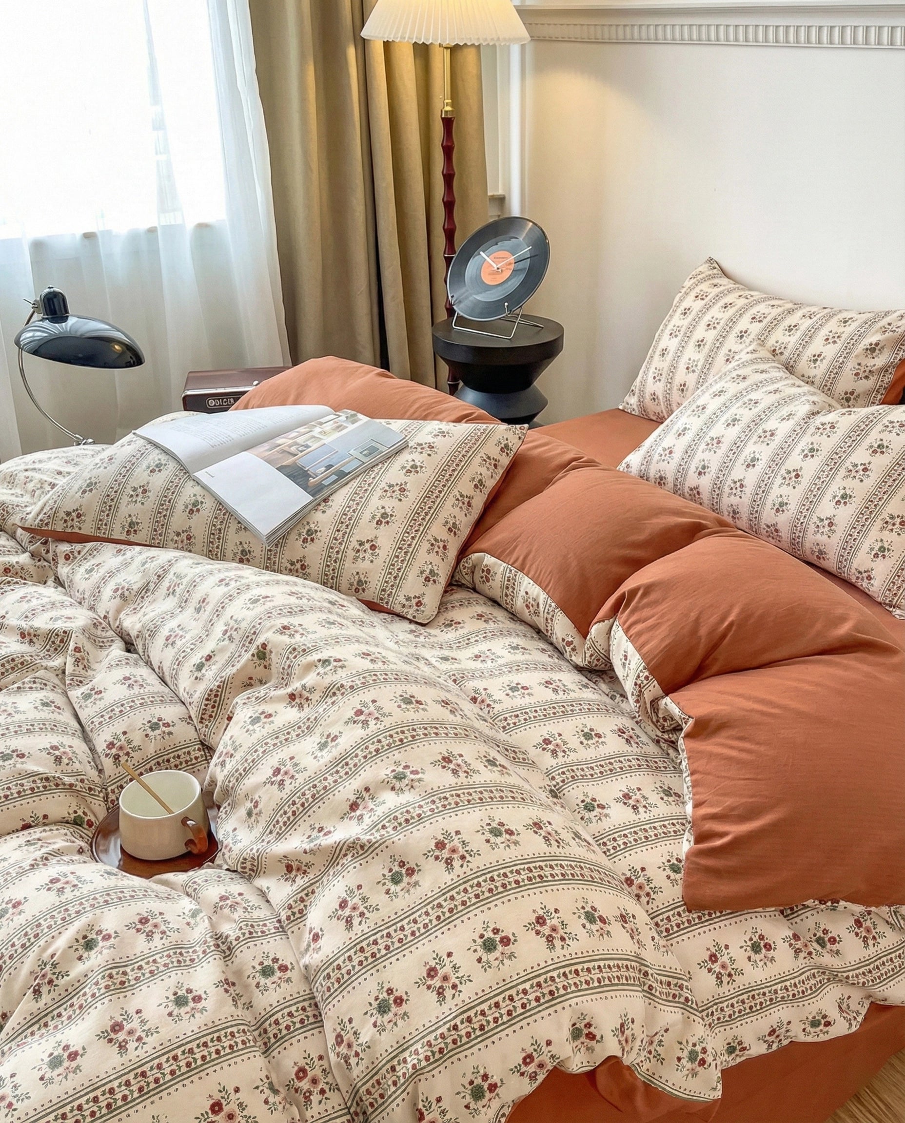 Terracotta floral duvet cover set with striped vintage pattern and layered pillows, warm neutral bedroom decor