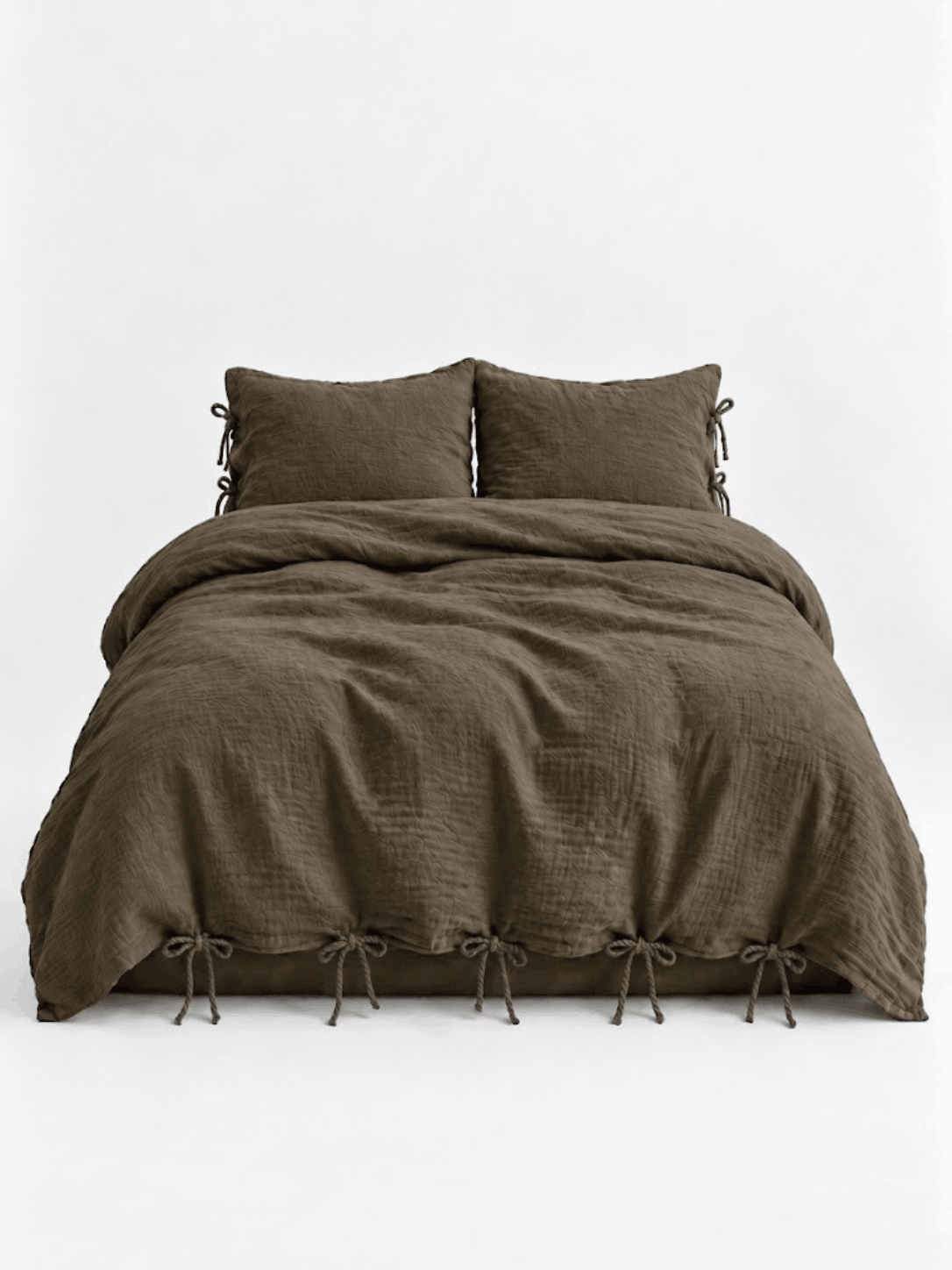 Truffle muslin cotton duvet cover set by DORMÉ Studio with bow tie closures, front view on white background