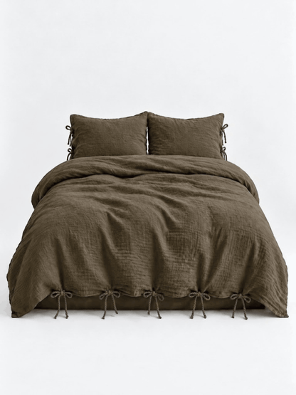 Truffle muslin cotton duvet cover set by DORMÉ Studio with bow tie closures, front view on white background