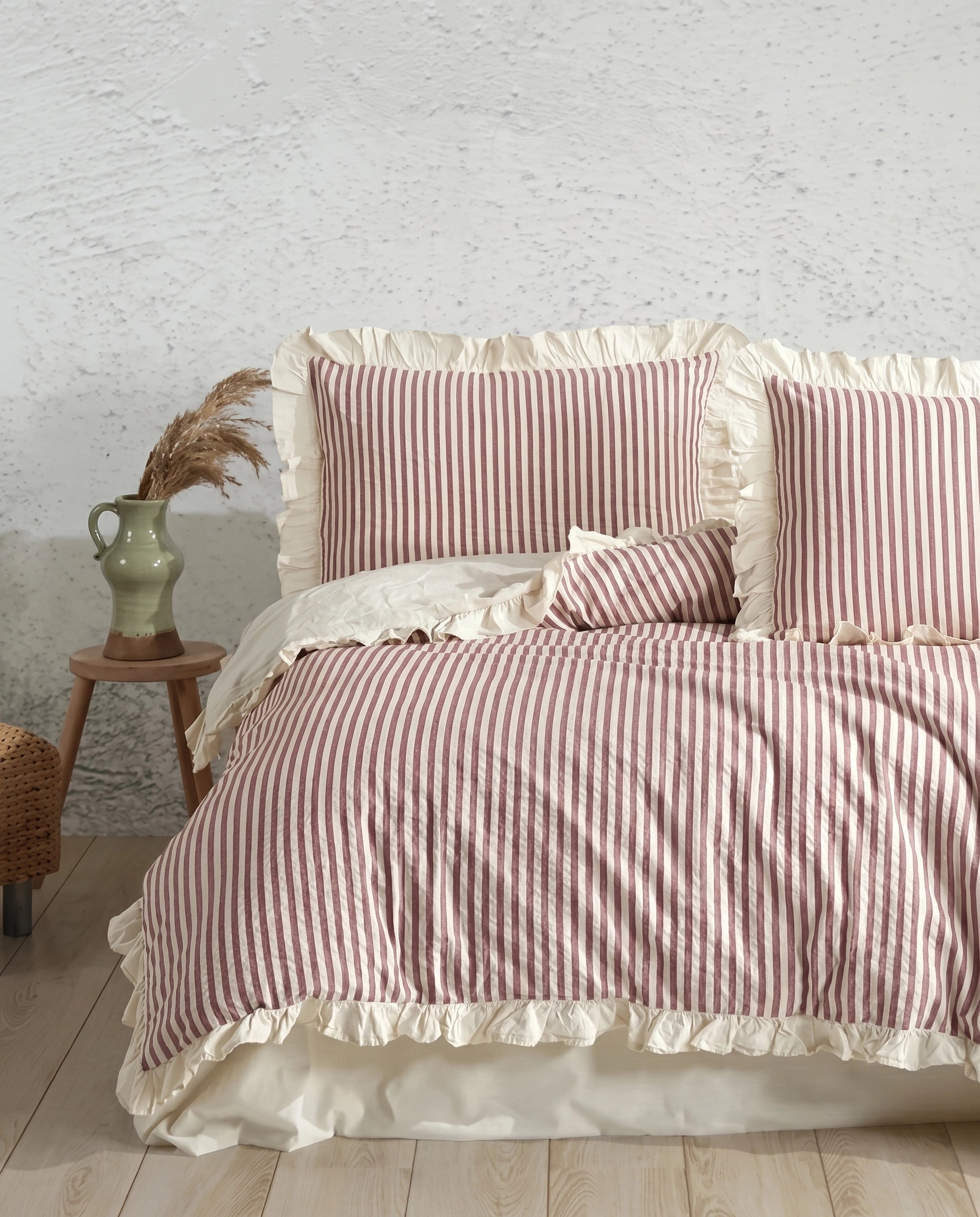Vintage inspired blush stripe cotton duvet cover set with ivory ruffled edges and cozy cottage bedroom aesthetic